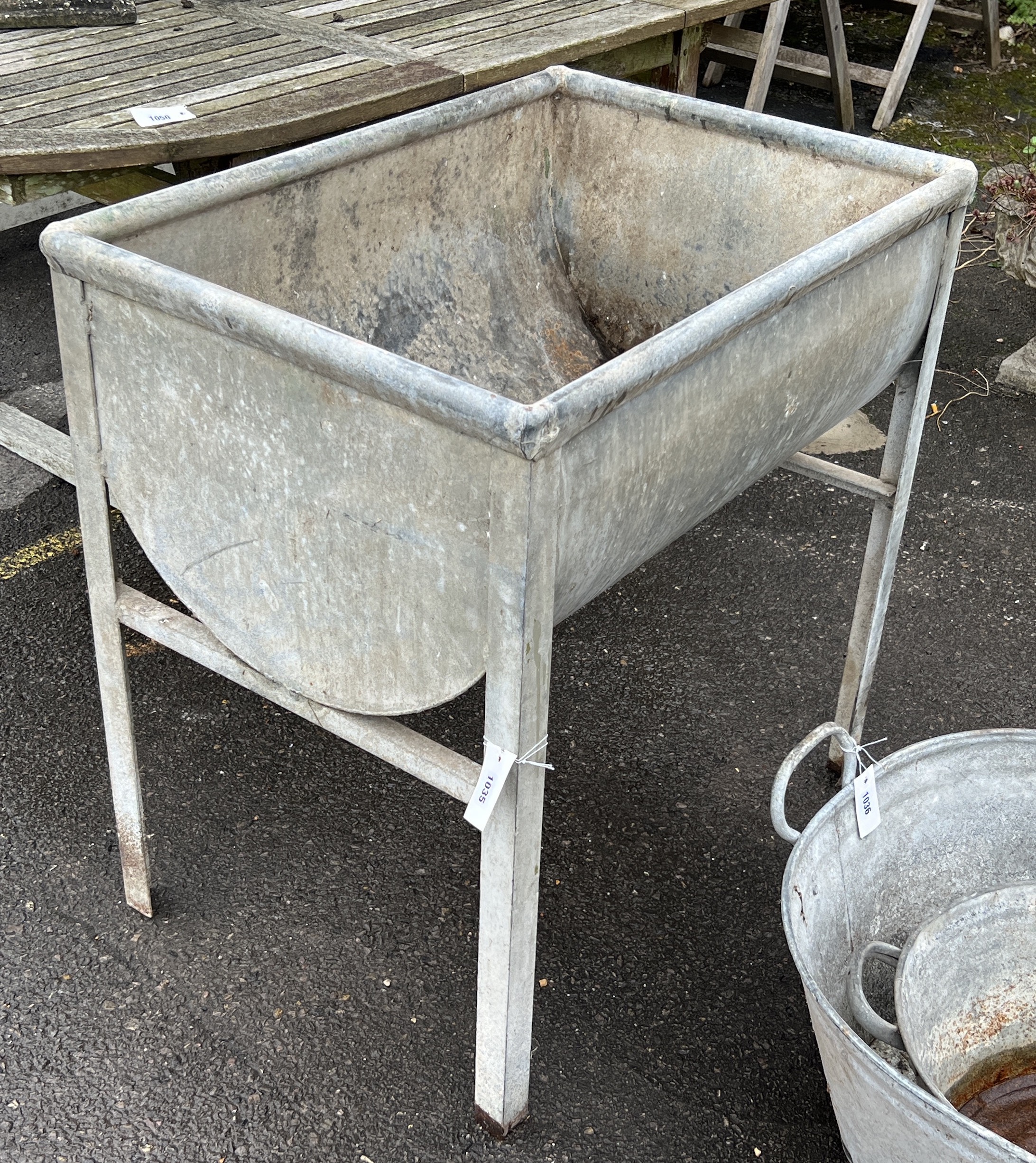 A vintage rectangular galvanised water trough, length 80cm, depth 56cm, height 82cm